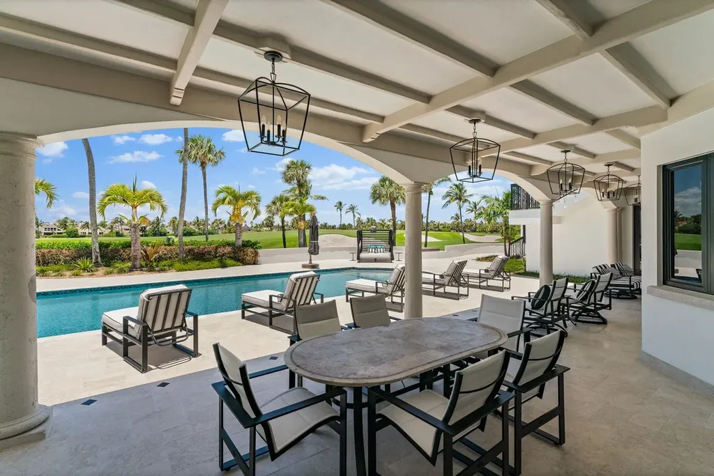 3057 SE Dune Drive Home in Stuart, Florida. Discover this artfully reimagined and fully renovated home boasting panoramic views of a Jack Nicklaus golf course, the lake, and the ocean. Flooded with natural light through 166 windows, the neutral palette accentuates exquisite finishes and architectural details. 