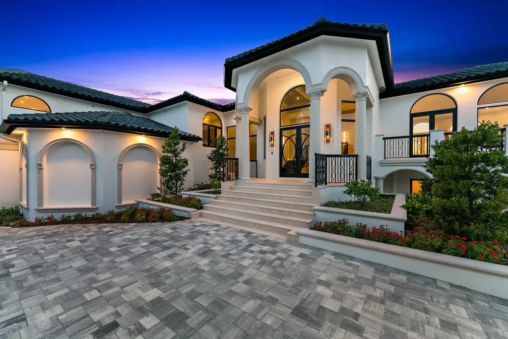 3057 SE Dune Drive Home in Stuart, Florida. Discover this artfully reimagined and fully renovated home boasting panoramic views of a Jack Nicklaus golf course, the lake, and the ocean. Flooded with natural light through 166 windows, the neutral palette accentuates exquisite finishes and architectural details. 