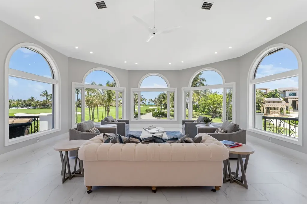 3057 SE Dune Drive Home in Stuart, Florida. Discover this artfully reimagined and fully renovated home boasting panoramic views of a Jack Nicklaus golf course, the lake, and the ocean. Flooded with natural light through 166 windows, the neutral palette accentuates exquisite finishes and architectural details. 