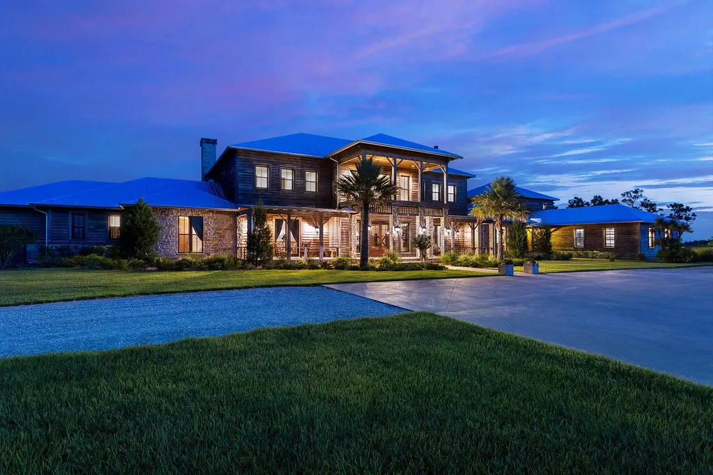 3160 NE 233 Road Trial Home in Okeechobee, Florida. Discover the epitome of refined luxury and countryside charm at PineHaven Ranch, nestled within the prestigious Pine Creek Sporting Club enclave. With 9 bedrooms, 7.1 bathrooms, a private lake, custom cypress accents, and access to elite amenities like the Member's Lodge and equestrian center.