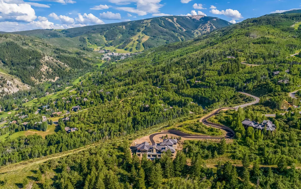335 Elkhorn Court Home in Avon, Colorado. Discover the epitome of mountain luxury at this secluded Bachelor Gulch estate overlooking Beaver Creek Resort. Offering privacy and sweeping views of the Gore Range, Game Creek Bowl, and more, this alpine haven features ski-in/ski-out access, smart home technology, exquisite design details, and state-of-the-art amenities. 