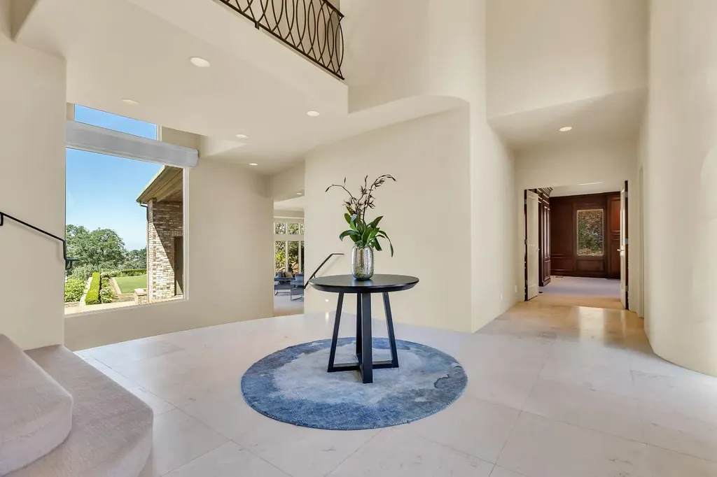 4160 Marble Ridge Road Home in El Dorado Hills, California. Discover the extraordinary 10-acre hilltop estate offering breathtaking views and a resort-like experience. This stately home features massive floor-to-ceiling windows, an elegant living room with a full bar, and a modern great room with a gourmet kitchen.