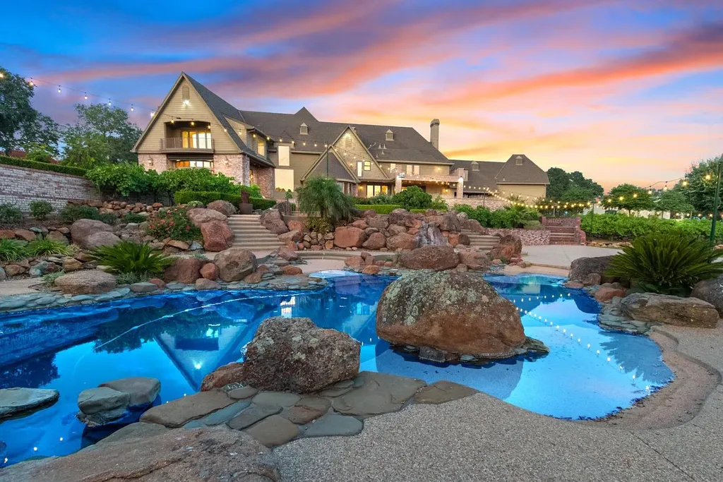 4160 Marble Ridge Road Home in El Dorado Hills, California. Discover the extraordinary 10-acre hilltop estate offering breathtaking views and a resort-like experience. This stately home features massive floor-to-ceiling windows, an elegant living room with a full bar, and a modern great room with a gourmet kitchen.