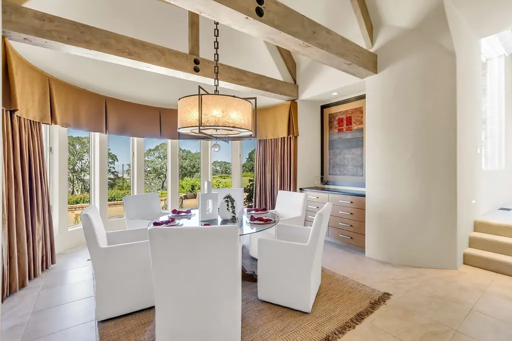 4160 Marble Ridge Road Home in El Dorado Hills, California. Discover the extraordinary 10-acre hilltop estate offering breathtaking views and a resort-like experience. This stately home features massive floor-to-ceiling windows, an elegant living room with a full bar, and a modern great room with a gourmet kitchen.