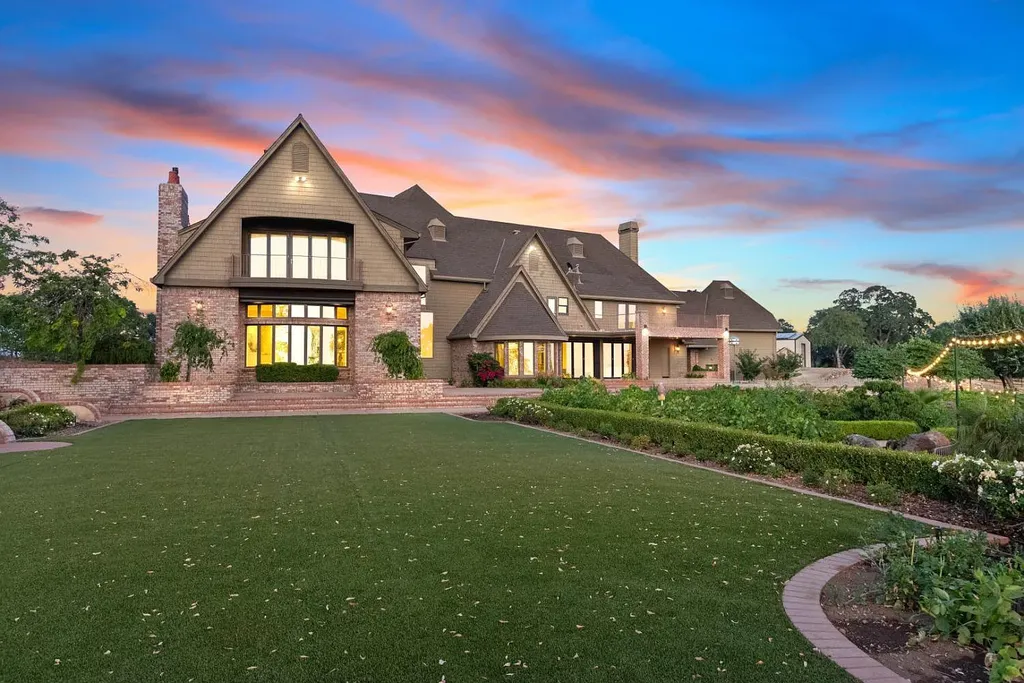 4160 Marble Ridge Road Home in El Dorado Hills, California. Discover the extraordinary 10-acre hilltop estate offering breathtaking views and a resort-like experience. This stately home features massive floor-to-ceiling windows, an elegant living room with a full bar, and a modern great room with a gourmet kitchen.