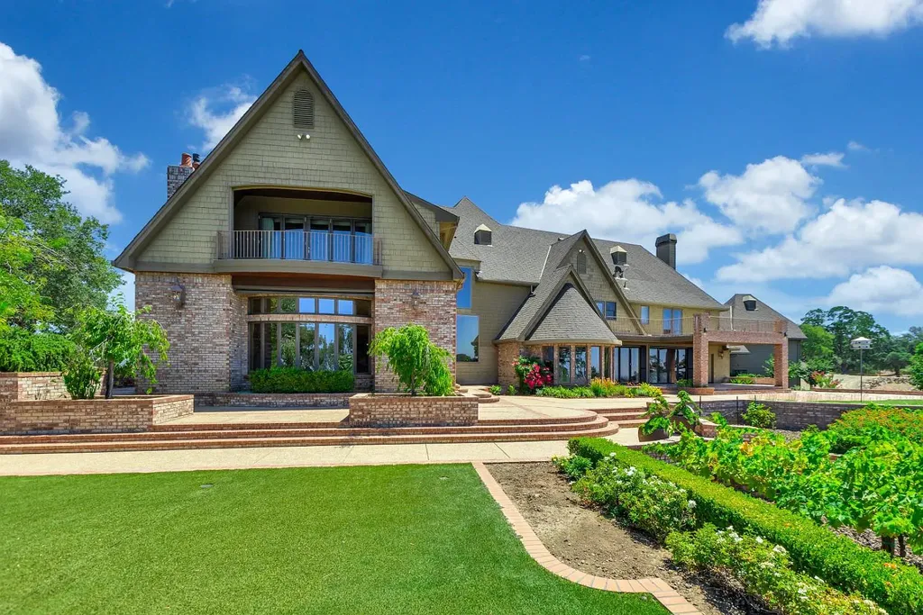 4160 Marble Ridge Road Home in El Dorado Hills, California. Discover the extraordinary 10-acre hilltop estate offering breathtaking views and a resort-like experience. This stately home features massive floor-to-ceiling windows, an elegant living room with a full bar, and a modern great room with a gourmet kitchen.