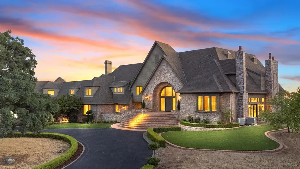 4160 Marble Ridge Road Home in El Dorado Hills, California. Discover the extraordinary 10-acre hilltop estate offering breathtaking views and a resort-like experience. This stately home features massive floor-to-ceiling windows, an elegant living room with a full bar, and a modern great room with a gourmet kitchen.