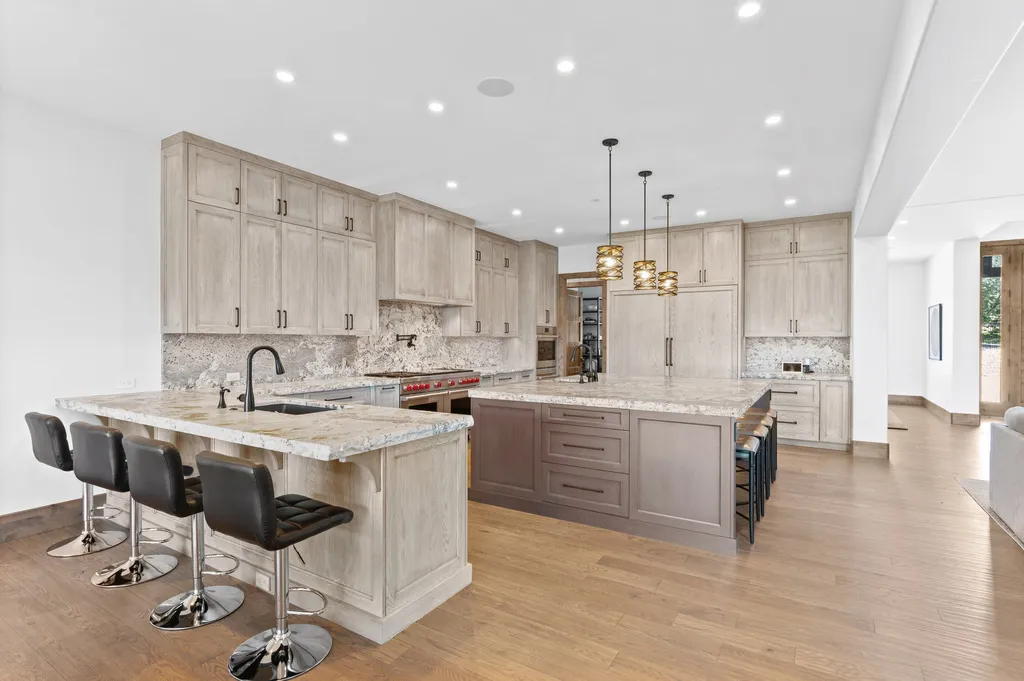 4480 S Holly Street Home in Cherry Hills Village, Colorado. Discover a masterpiece of modern luxury and sustainable living in Cherry Hills Village. This 2022-built home showcases the perfect blend of sophistication and Colorado charm, featuring geothermal heating, Tesla powerwalls, commercial solar panels, and advanced technology. 