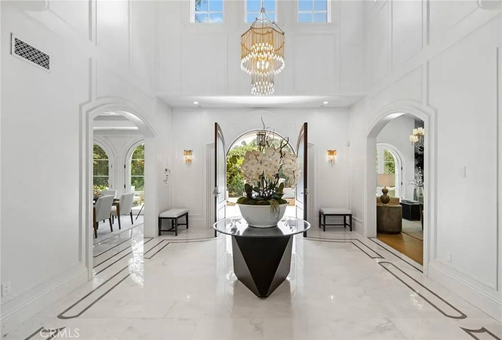 470 Virginia Road Home in San Marino, California. Discover the epitome of modern luxury living in this brand new San Marino home. Built by Rykadan Intl, designed by ilustracion by Jake, and developed by Bowden Development, this 8000 sqft estate offers impeccable finishes, high-end amenities, and an expansive outdoor oasis. With 6 bedrooms, 7.5 baths, a state-of-the-art home theater, gym, and pool, this is the ultimate in convenience and comfort.