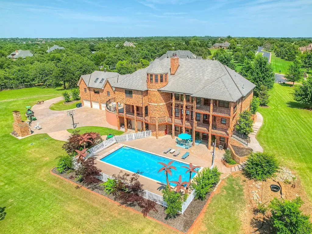 5001 Carrington Place Home in Oklahoma City, Oklahoma. Prepare to be entranced by the awe-inspiring surroundings of this exceptional estate, a harmonious blend of functionality, design, and unparalleled craftsmanship. From the moment you step inside, you'll be greeted by the elegance of quarter-sawn white oak doors, floors, and trim that evoke a sense of refined luxury.