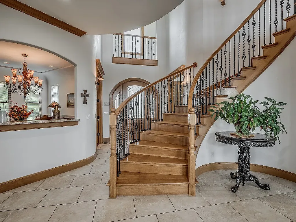 5001 Carrington Place Home in Oklahoma City, Oklahoma. Prepare to be entranced by the awe-inspiring surroundings of this exceptional estate, a harmonious blend of functionality, design, and unparalleled craftsmanship. From the moment you step inside, you'll be greeted by the elegance of quarter-sawn white oak doors, floors, and trim that evoke a sense of refined luxury.