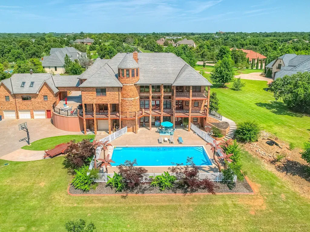 5001 Carrington Place Home in Oklahoma City, Oklahoma. Prepare to be entranced by the awe-inspiring surroundings of this exceptional estate, a harmonious blend of functionality, design, and unparalleled craftsmanship. From the moment you step inside, you'll be greeted by the elegance of quarter-sawn white oak doors, floors, and trim that evoke a sense of refined luxury.