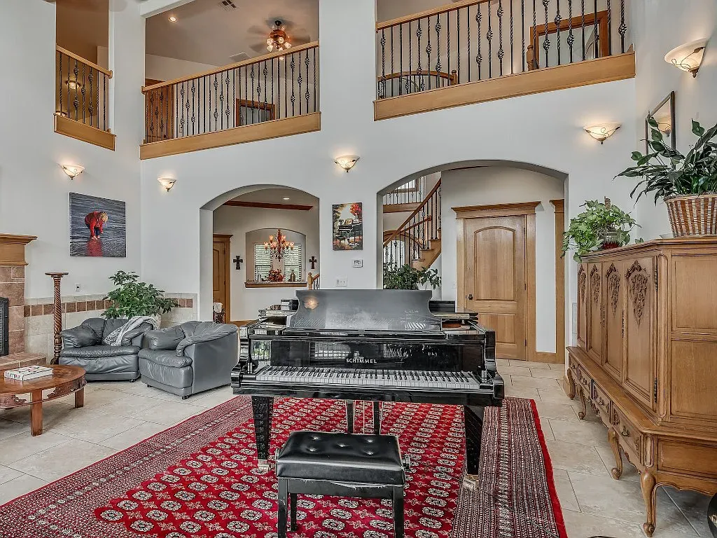 5001 Carrington Place Home in Oklahoma City, Oklahoma. Prepare to be entranced by the awe-inspiring surroundings of this exceptional estate, a harmonious blend of functionality, design, and unparalleled craftsmanship. From the moment you step inside, you'll be greeted by the elegance of quarter-sawn white oak doors, floors, and trim that evoke a sense of refined luxury.