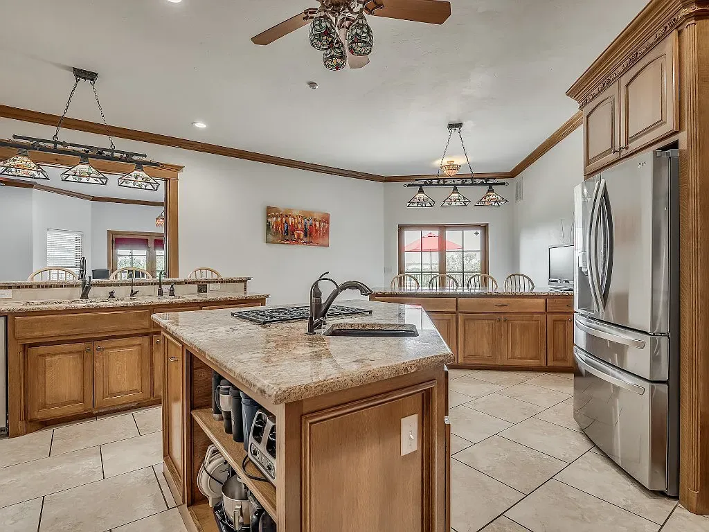 5001 Carrington Place Home in Oklahoma City, Oklahoma. Prepare to be entranced by the awe-inspiring surroundings of this exceptional estate, a harmonious blend of functionality, design, and unparalleled craftsmanship. From the moment you step inside, you'll be greeted by the elegance of quarter-sawn white oak doors, floors, and trim that evoke a sense of refined luxury.