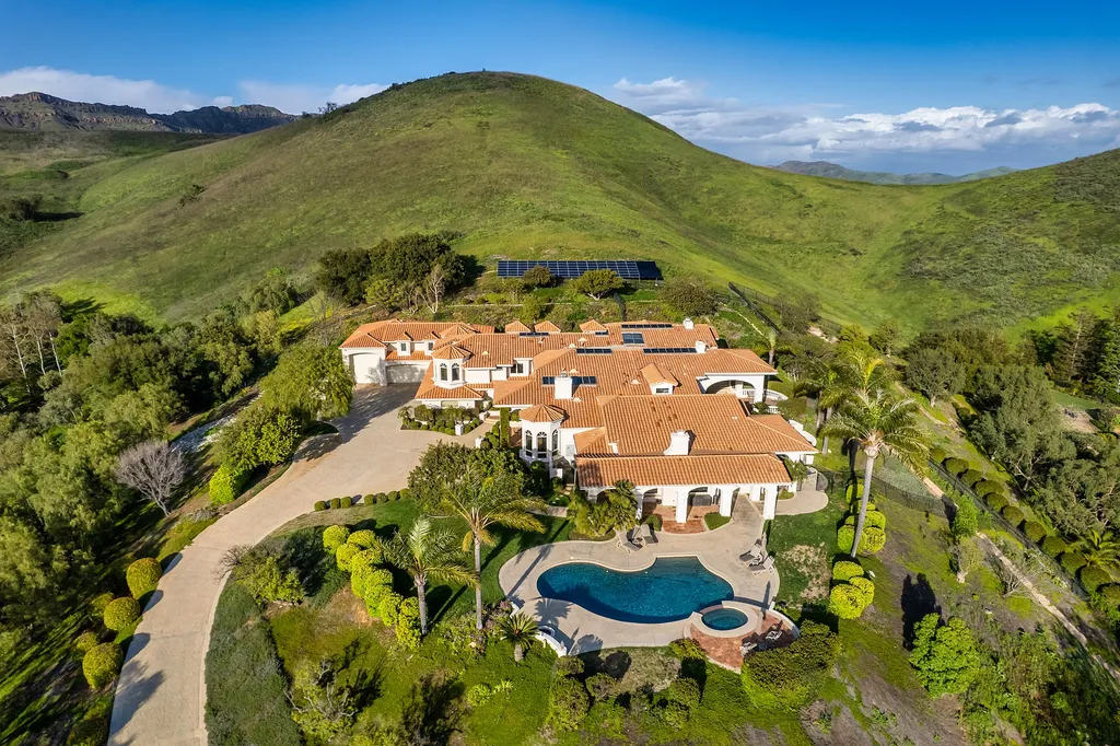 5063 Hunter Valley Lane Home in Westlake Village, California. Discover the epitome of luxury living in this epic Mediterranean compound, nestled on approximately 3.6 acres of prime land behind private gates in guard-gated North Ranch Country Club Estates. Enjoy complete privacy and breathtaking panoramic views from this approximately 9500 square foot hilltop estate.