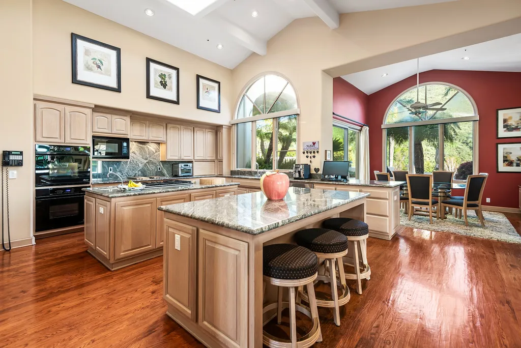 5063 Hunter Valley Lane Home in Westlake Village, California. Discover the epitome of luxury living in this epic Mediterranean compound, nestled on approximately 3.6 acres of prime land behind private gates in guard-gated North Ranch Country Club Estates. Enjoy complete privacy and breathtaking panoramic views from this approximately 9500 square foot hilltop estate.