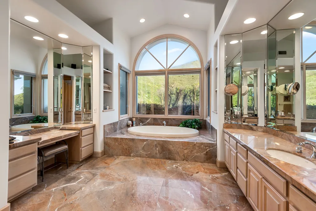 5063 Hunter Valley Lane Home in Westlake Village, California. Discover the epitome of luxury living in this epic Mediterranean compound, nestled on approximately 3.6 acres of prime land behind private gates in guard-gated North Ranch Country Club Estates. Enjoy complete privacy and breathtaking panoramic views from this approximately 9500 square foot hilltop estate.