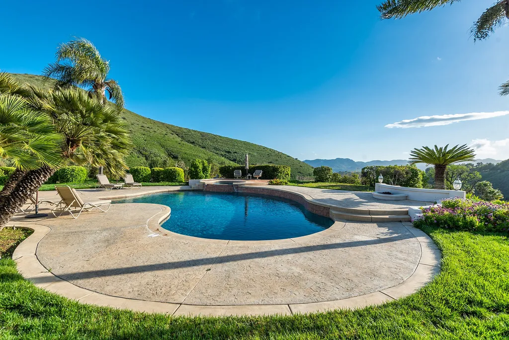 5063 Hunter Valley Lane Home in Westlake Village, California. Discover the epitome of luxury living in this epic Mediterranean compound, nestled on approximately 3.6 acres of prime land behind private gates in guard-gated North Ranch Country Club Estates. Enjoy complete privacy and breathtaking panoramic views from this approximately 9500 square foot hilltop estate.