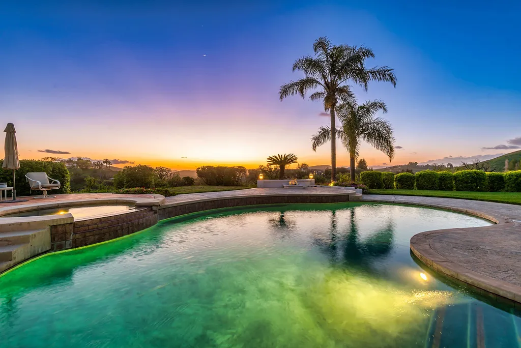 5063 Hunter Valley Lane Home in Westlake Village, California. Discover the epitome of luxury living in this epic Mediterranean compound, nestled on approximately 3.6 acres of prime land behind private gates in guard-gated North Ranch Country Club Estates. Enjoy complete privacy and breathtaking panoramic views from this approximately 9500 square foot hilltop estate.