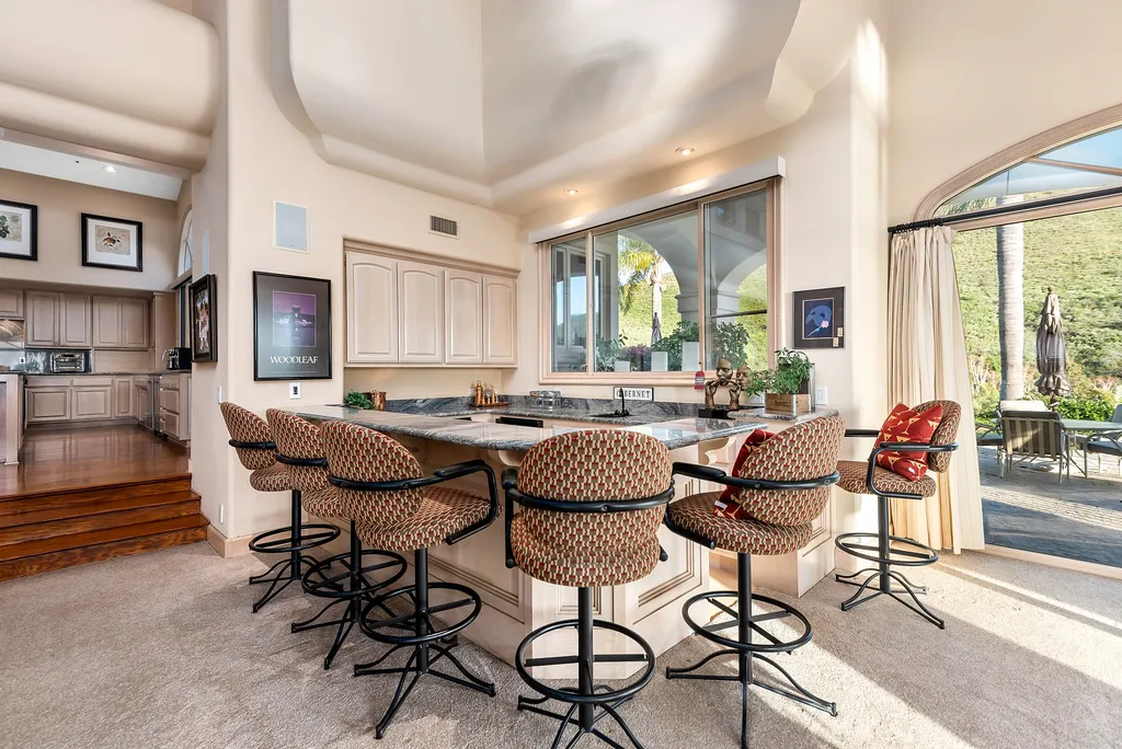 5063 Hunter Valley Lane Home in Westlake Village, California. Discover the epitome of luxury living in this epic Mediterranean compound, nestled on approximately 3.6 acres of prime land behind private gates in guard-gated North Ranch Country Club Estates. Enjoy complete privacy and breathtaking panoramic views from this approximately 9500 square foot hilltop estate.