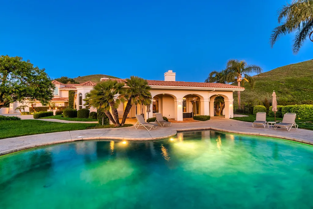 5063 Hunter Valley Lane Home in Westlake Village, California. Discover the epitome of luxury living in this epic Mediterranean compound, nestled on approximately 3.6 acres of prime land behind private gates in guard-gated North Ranch Country Club Estates. Enjoy complete privacy and breathtaking panoramic views from this approximately 9500 square foot hilltop estate.