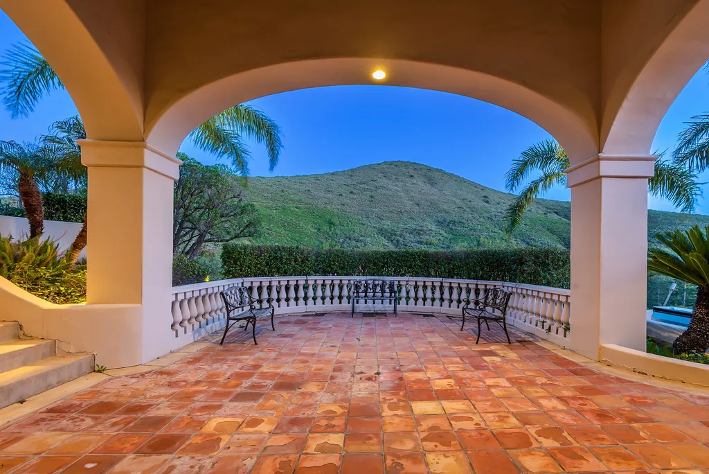 5063 Hunter Valley Lane Home in Westlake Village, California. Discover the epitome of luxury living in this epic Mediterranean compound, nestled on approximately 3.6 acres of prime land behind private gates in guard-gated North Ranch Country Club Estates. Enjoy complete privacy and breathtaking panoramic views from this approximately 9500 square foot hilltop estate.