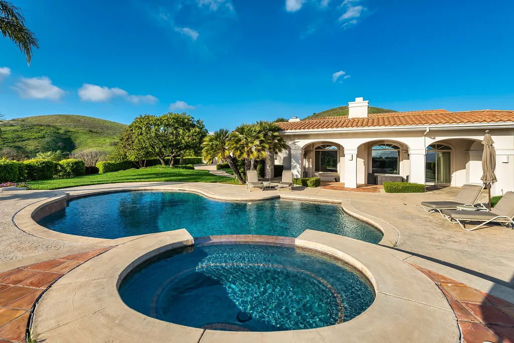 5063 Hunter Valley Lane Home in Westlake Village, California. Discover the epitome of luxury living in this epic Mediterranean compound, nestled on approximately 3.6 acres of prime land behind private gates in guard-gated North Ranch Country Club Estates. Enjoy complete privacy and breathtaking panoramic views from this approximately 9500 square foot hilltop estate.