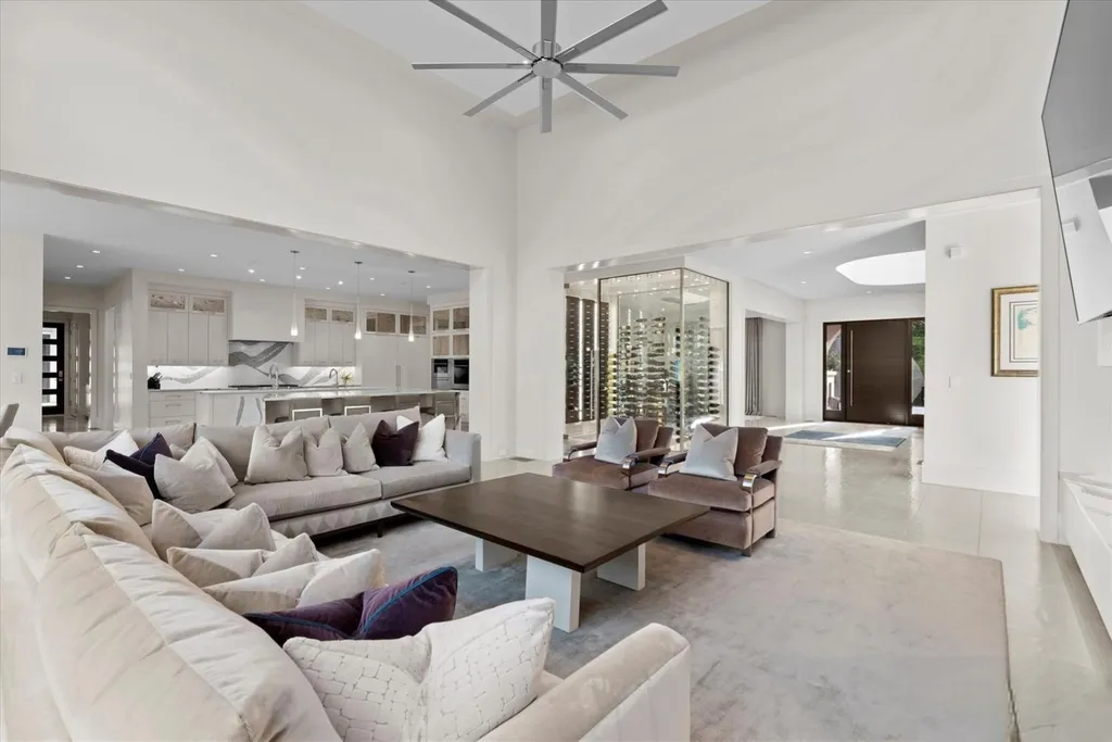 519 Brackenbury Lane Home in Charlotte, North Carolina. Discover a truly unique modern Kingswood Home built in 2019, an exquisite and meticulously designed residence that showcases the epitome of luxury living. With 7,491 square feet spread over 2 acres, this home boasts a custom curved stairwell by Artisan, a stunning glass refrigerated wine display room, and Walker Zanger light gray stone tile throughout the main and upper levels. 