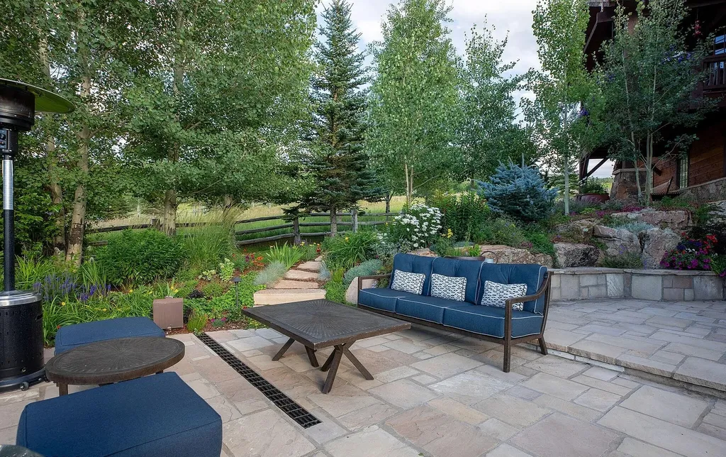 520 Old Creamery Road Home in Edwards, Colorado. Little Bear is a sprawling mountain estate spanning over three acres of Colorado canvas. The property is a true ode to nature, showcasing Colorado's beauty with its mature mountain landscaping, charming gardens, and a curated wildflower garden along the main drive.
