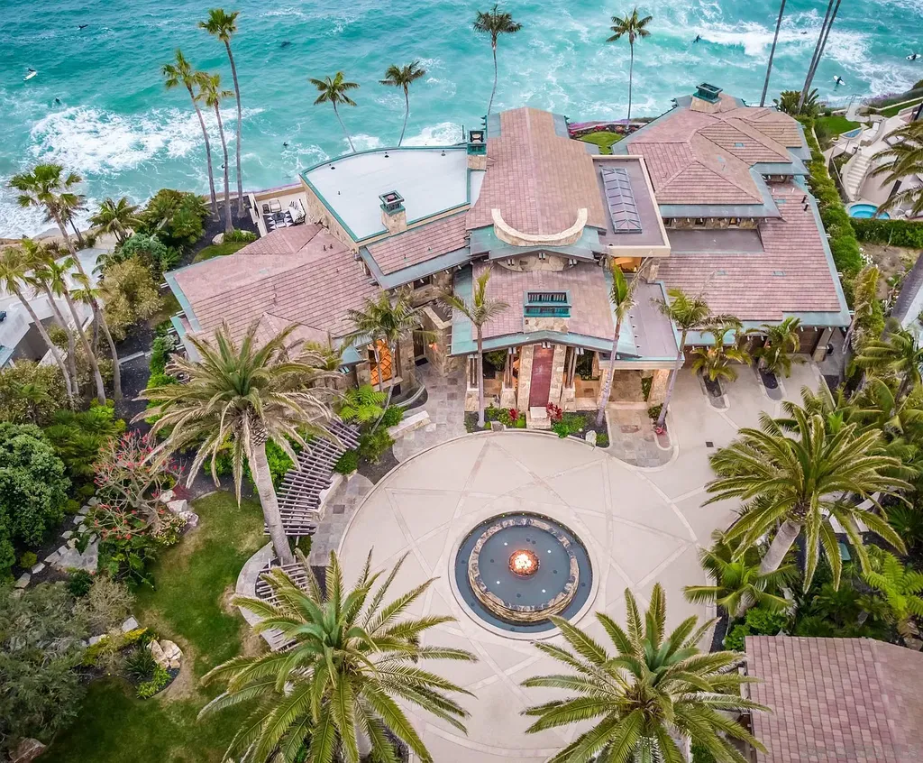 5305 Carlsbad Boulevard Home in Carlsbad, California. Experience the epitome of Southern California coastal living on this extraordinary 1.5-acre oceanfront property. With 165 feet of pristine coastline, panoramic Pacific Ocean views, private beach access, and stunning outdoor spaces, this 5-bedroom estate offers unparalleled luxury.