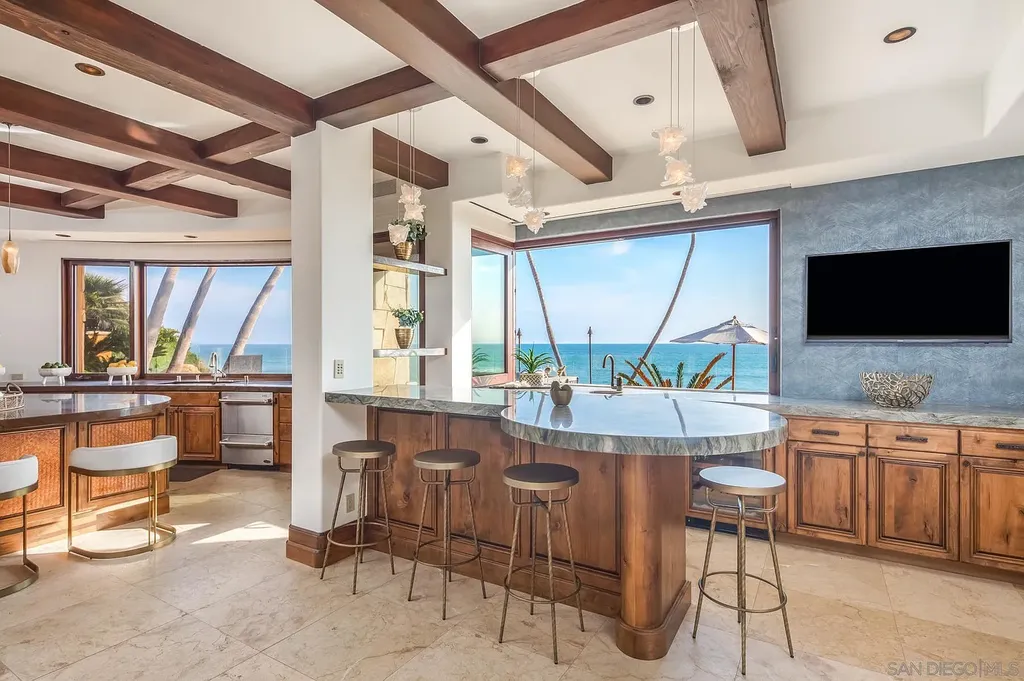 5305 Carlsbad Boulevard Home in Carlsbad, California. Experience the epitome of Southern California coastal living on this extraordinary 1.5-acre oceanfront property. With 165 feet of pristine coastline, panoramic Pacific Ocean views, private beach access, and stunning outdoor spaces, this 5-bedroom estate offers unparalleled luxury.