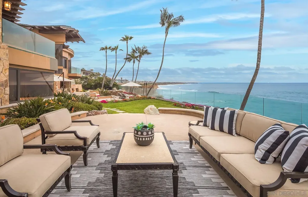 5305 Carlsbad Boulevard Home in Carlsbad, California. Experience the epitome of Southern California coastal living on this extraordinary 1.5-acre oceanfront property. With 165 feet of pristine coastline, panoramic Pacific Ocean views, private beach access, and stunning outdoor spaces, this 5-bedroom estate offers unparalleled luxury.