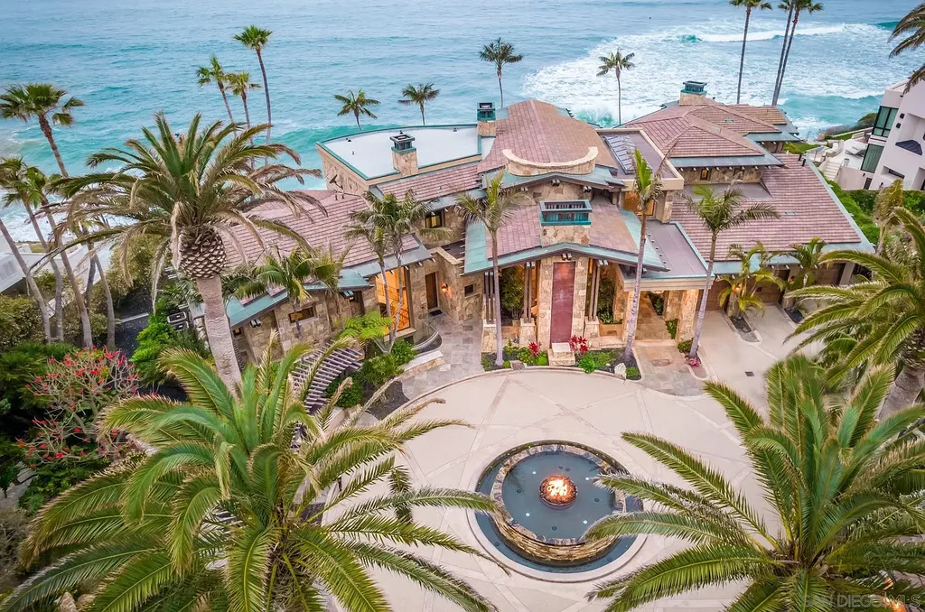 5305 Carlsbad Boulevard Home in Carlsbad, California. Experience the epitome of Southern California coastal living on this extraordinary 1.5-acre oceanfront property. With 165 feet of pristine coastline, panoramic Pacific Ocean views, private beach access, and stunning outdoor spaces, this 5-bedroom estate offers unparalleled luxury.