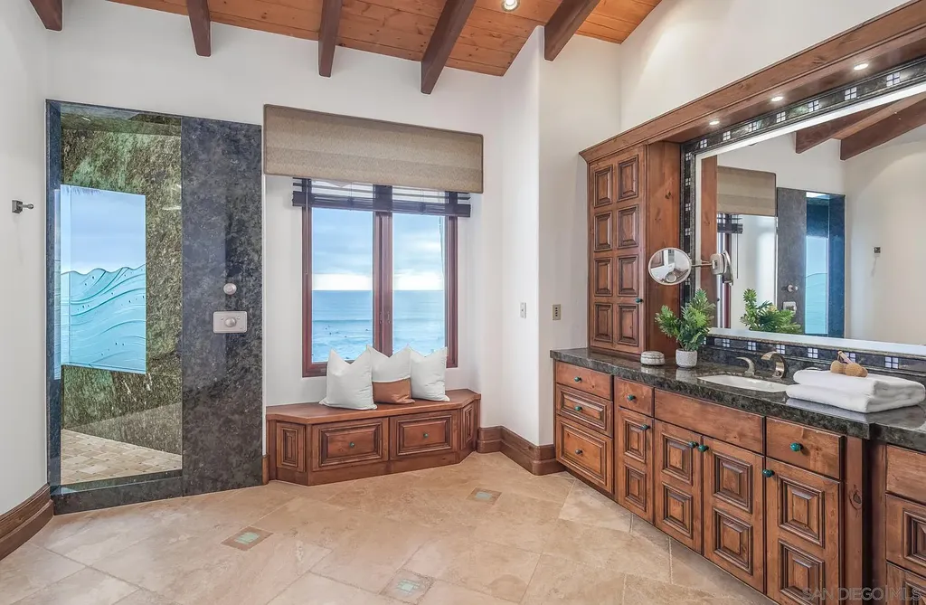 5305 Carlsbad Boulevard Home in Carlsbad, California. Experience the epitome of Southern California coastal living on this extraordinary 1.5-acre oceanfront property. With 165 feet of pristine coastline, panoramic Pacific Ocean views, private beach access, and stunning outdoor spaces, this 5-bedroom estate offers unparalleled luxury.