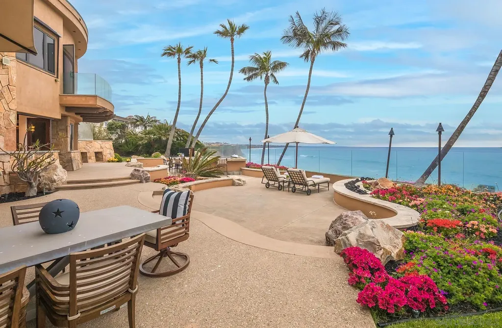 5305 Carlsbad Boulevard Home in Carlsbad, California. Experience the epitome of Southern California coastal living on this extraordinary 1.5-acre oceanfront property. With 165 feet of pristine coastline, panoramic Pacific Ocean views, private beach access, and stunning outdoor spaces, this 5-bedroom estate offers unparalleled luxury.