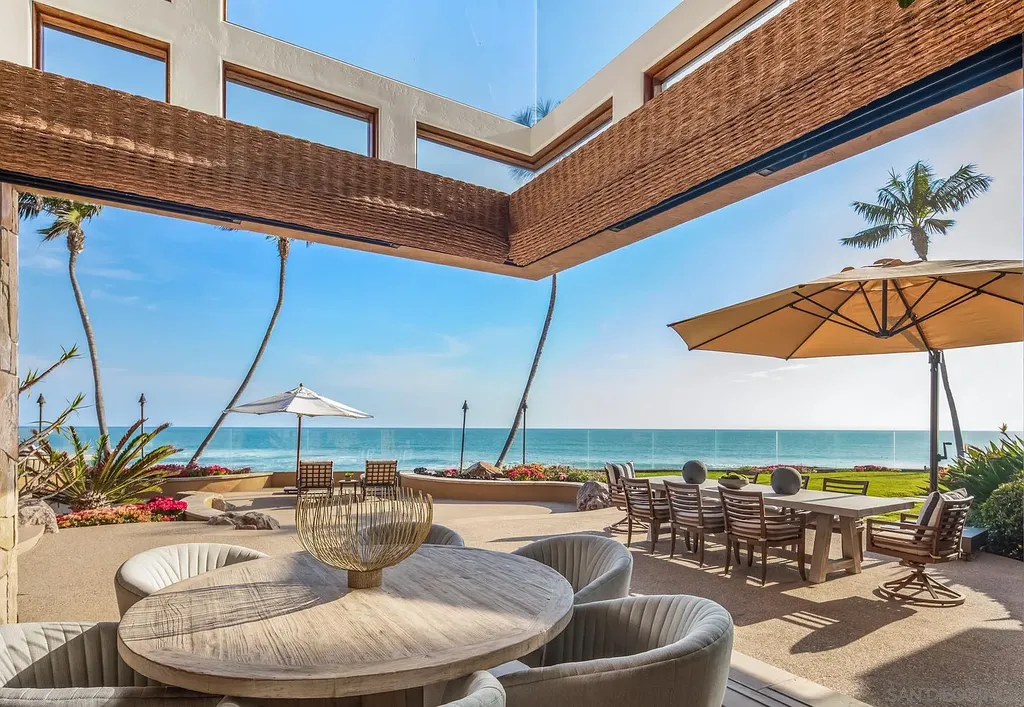 5305 Carlsbad Boulevard Home in Carlsbad, California. Experience the epitome of Southern California coastal living on this extraordinary 1.5-acre oceanfront property. With 165 feet of pristine coastline, panoramic Pacific Ocean views, private beach access, and stunning outdoor spaces, this 5-bedroom estate offers unparalleled luxury.