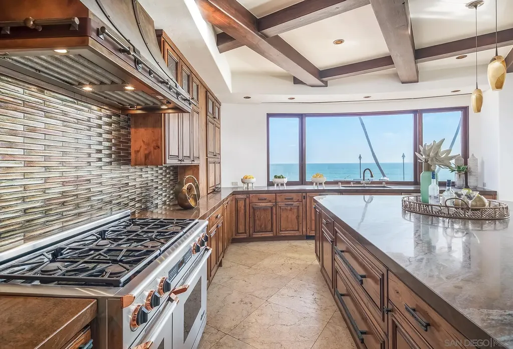 5305 Carlsbad Boulevard Home in Carlsbad, California. Experience the epitome of Southern California coastal living on this extraordinary 1.5-acre oceanfront property. With 165 feet of pristine coastline, panoramic Pacific Ocean views, private beach access, and stunning outdoor spaces, this 5-bedroom estate offers unparalleled luxury.
