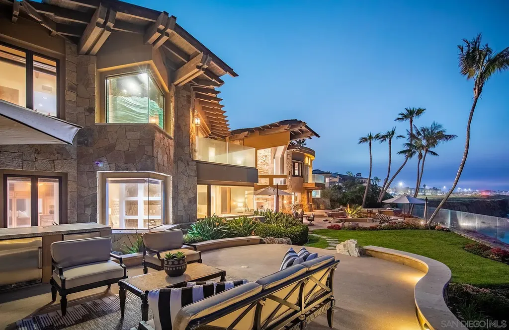 5305 Carlsbad Boulevard Home in Carlsbad, California. Experience the epitome of Southern California coastal living on this extraordinary 1.5-acre oceanfront property. With 165 feet of pristine coastline, panoramic Pacific Ocean views, private beach access, and stunning outdoor spaces, this 5-bedroom estate offers unparalleled luxury.