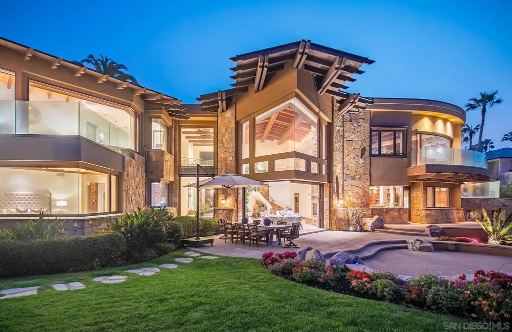 5305 Carlsbad Boulevard Home in Carlsbad, California. Experience the epitome of Southern California coastal living on this extraordinary 1.5-acre oceanfront property. With 165 feet of pristine coastline, panoramic Pacific Ocean views, private beach access, and stunning outdoor spaces, this 5-bedroom estate offers unparalleled luxury.