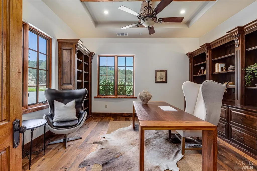 5343-5355 Suisun Valley Road Home in Fairfield, California. Stunning 20-acre hilltop compound in Fairfield boasts panoramic views of the valley, vineyards, and Mount Diablo. The Tuscan-inspired main house features cathedral ceilings, antique beams, and travertine flooring. The majestic living/dining great room has a fireplace and overlooks the pool, patio, and views. 