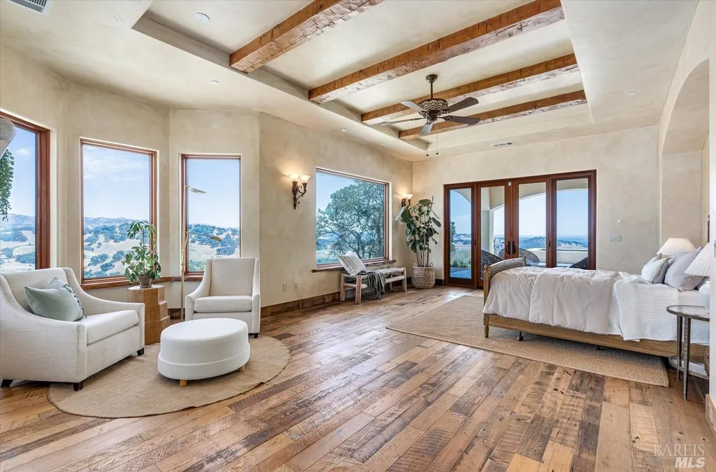 5343-5355 Suisun Valley Road Home in Fairfield, California. Stunning 20-acre hilltop compound in Fairfield boasts panoramic views of the valley, vineyards, and Mount Diablo. The Tuscan-inspired main house features cathedral ceilings, antique beams, and travertine flooring. The majestic living/dining great room has a fireplace and overlooks the pool, patio, and views. 