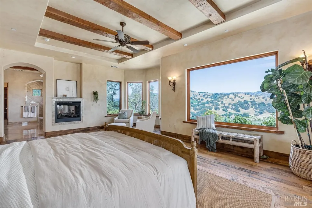 5343-5355 Suisun Valley Road Home in Fairfield, California. Stunning 20-acre hilltop compound in Fairfield boasts panoramic views of the valley, vineyards, and Mount Diablo. The Tuscan-inspired main house features cathedral ceilings, antique beams, and travertine flooring. The majestic living/dining great room has a fireplace and overlooks the pool, patio, and views. 