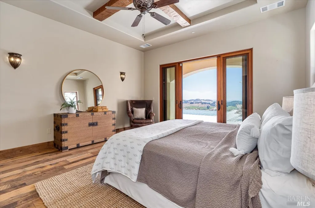 5343-5355 Suisun Valley Road Home in Fairfield, California. Stunning 20-acre hilltop compound in Fairfield boasts panoramic views of the valley, vineyards, and Mount Diablo. The Tuscan-inspired main house features cathedral ceilings, antique beams, and travertine flooring. The majestic living/dining great room has a fireplace and overlooks the pool, patio, and views. 