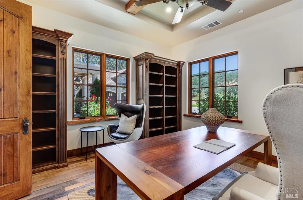 5343-5355 Suisun Valley Road Home in Fairfield, California. Stunning 20-acre hilltop compound in Fairfield boasts panoramic views of the valley, vineyards, and Mount Diablo. The Tuscan-inspired main house features cathedral ceilings, antique beams, and travertine flooring. The majestic living/dining great room has a fireplace and overlooks the pool, patio, and views. 
