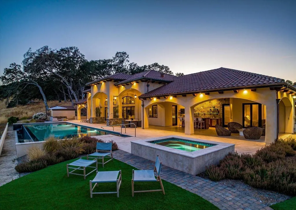5343-5355 Suisun Valley Road Home in Fairfield, California. Stunning 20-acre hilltop compound in Fairfield boasts panoramic views of the valley, vineyards, and Mount Diablo. The Tuscan-inspired main house features cathedral ceilings, antique beams, and travertine flooring. The majestic living/dining great room has a fireplace and overlooks the pool, patio, and views. 