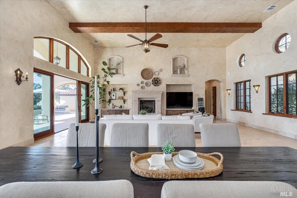 5343-5355 Suisun Valley Road Home in Fairfield, California. Stunning 20-acre hilltop compound in Fairfield boasts panoramic views of the valley, vineyards, and Mount Diablo. The Tuscan-inspired main house features cathedral ceilings, antique beams, and travertine flooring. The majestic living/dining great room has a fireplace and overlooks the pool, patio, and views. 