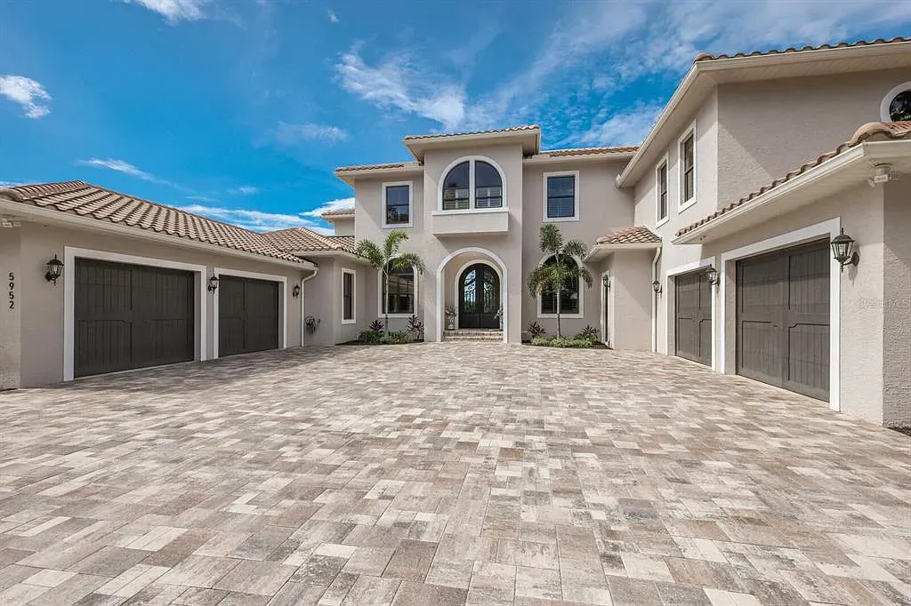 5952 Vanderipe Road Home in Sarasota, Florida. Discover luxurious country living at its finest in this custom-designed home nestled on a sprawling equestrian estate in Myakka Valley Ranches. With over 12 acres of land, two separate lots, and a meticulously crafted residence boasting modern amenities, this property offers a canvas for your dreams to flourish.