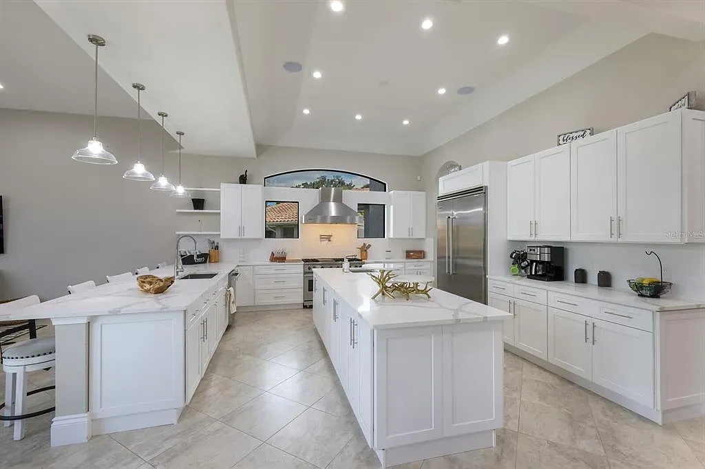 5952 Vanderipe Road Home in Sarasota, Florida. Discover luxurious country living at its finest in this custom-designed home nestled on a sprawling equestrian estate in Myakka Valley Ranches. With over 12 acres of land, two separate lots, and a meticulously crafted residence boasting modern amenities, this property offers a canvas for your dreams to flourish.