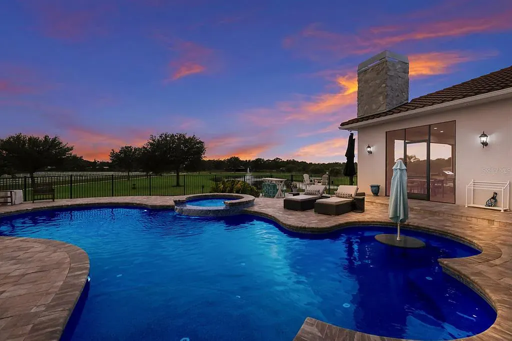 5952 Vanderipe Road Home in Sarasota, Florida. Discover luxurious country living at its finest in this custom-designed home nestled on a sprawling equestrian estate in Myakka Valley Ranches. With over 12 acres of land, two separate lots, and a meticulously crafted residence boasting modern amenities, this property offers a canvas for your dreams to flourish.