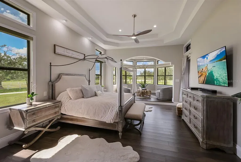 5952 Vanderipe Road Home in Sarasota, Florida. Discover luxurious country living at its finest in this custom-designed home nestled on a sprawling equestrian estate in Myakka Valley Ranches. With over 12 acres of land, two separate lots, and a meticulously crafted residence boasting modern amenities, this property offers a canvas for your dreams to flourish.